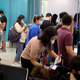 People crowd around a Covid-19 testing site at Miami International Airport on December 28, 2021 in Miami, Florida.